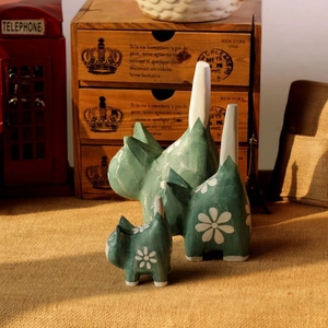 Hand-painted vintage green wooden cat figurines set with small flower patterns