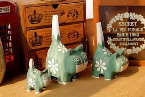 Set of three vintage green hand-painted wooden cat figurines with floral details