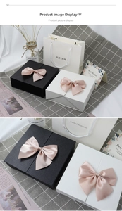 Elegant double-door gift box with pink satin bow and matching jewelry shopping bag