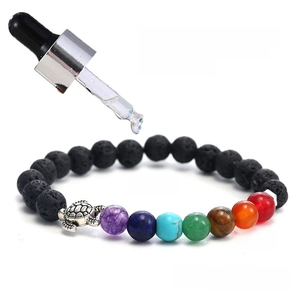 7 Chakra lava stone bead bracelet with turtle charm and essential oil application view