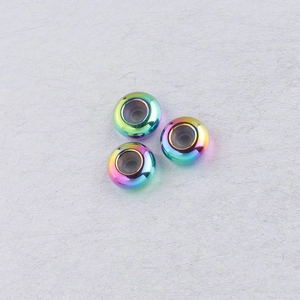 Macro view of rainbow stainless steel 8mm stopper beads with silicone inner ring