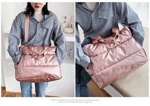 Macro detail of glossy pink quilted gym bag featuring waterproof fabric and spacious design