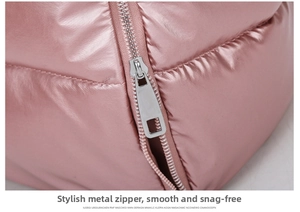 Close-up of smooth metal rectangular zipper pull on pink quilted fitness travel bag