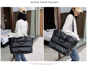 Detail of black quilted fitness tote bag with shoulder straps for sports and travel