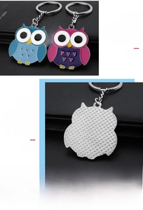Detail of cartoon owl keychain made of premium zinc alloy with colorful enamel finish
