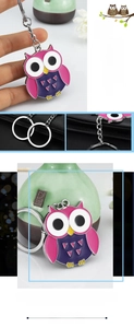 Detailed view of owl keychain featuring pink and purple enamel finish on alloy metal