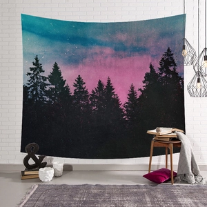Detail of Nordic starry forest tapestry featuring pink and blue pine silhouettes on white brick wall