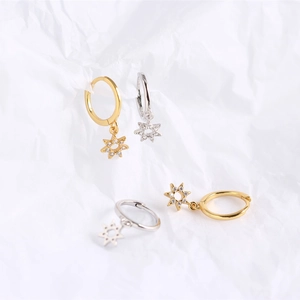 Detailed close-up of S925 sterling silver hexagonal star hoop earrings in gold and silver