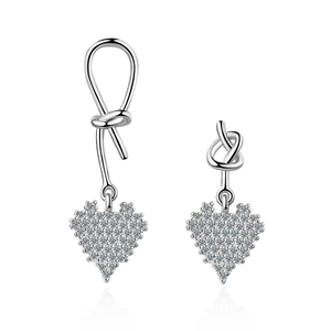 Asymmetric silver heart earrings with sparkling rhinestones and knot design detail