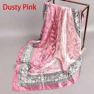 Detail of dusty rose paisley silk-like square scarf with elegant satin luster finish
