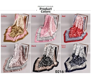 Detail view of paisley print satin scarves in six colors including red and navy blue