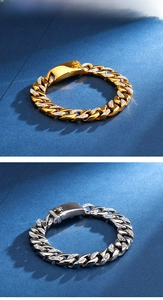 Detail of 18K gold and silver hip hop Cuban bracelets with sparkling rhinestones and box clasp