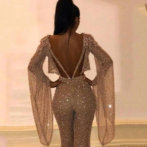 Sexy backless gold sequin jumpsuit with deep V-neck and dramatic flare sleeves for women