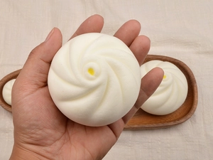 Macro detail of squishy cream bun toy with realistic texture and soft PU material
