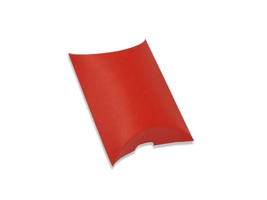 Close-up of a red pillow-shaped paper gift box with curved edges on a white background