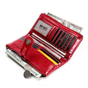 Detailed interior of red leather long wallet showing RFID card slots and zip coin pocket