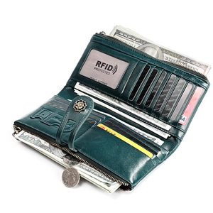 Detailed interior of a deep green leather wallet with RFID protection and card slots