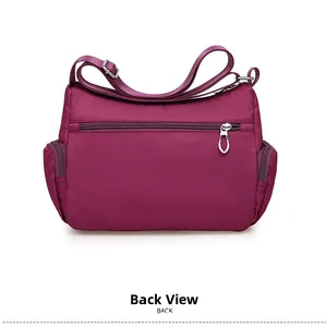 Rear view of purple nylon crossbody bag showing back zipper pocket and side pouches