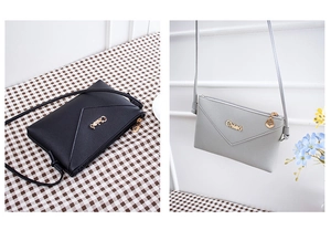 Macro view of envelope crossbody phone bags with Chloé logo and leaf-shaped metal zippers