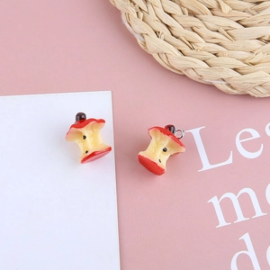 Macro view of realistic red apple core resin pendant for DIY jewelry making