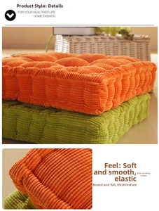 Close-up of thick corduroy chair cushions showing orange and green ribbed texture