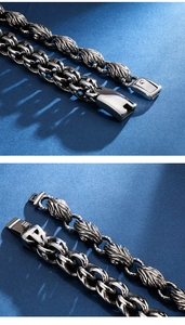 Close-up of vintage steel bracelets with detailed leaf texture and punk chain links