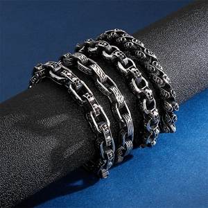 Men's retro silver stainless steel skull bracelets with punk gothic carvings on dark background