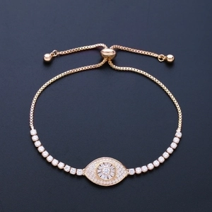 Pulsera ajustable ojo del mal dorada con micro pavé de cristales de circonita AAA