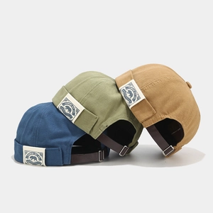 Vintage Docker Cap aus Baumwolle mit Polarbär-Patch und verstellbarem Lederarmband hinten