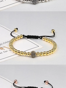 Detail of adjustable braided bracelets with zirconia beads in gold and silver finish