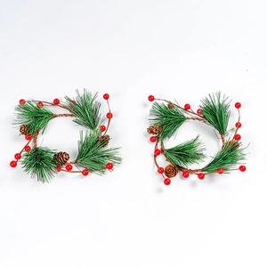Set of two Christmas wreaths with green pine needles, red berries and pine cones