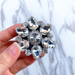 Macro shot of sparkling flower crystal phone socket on a white marble background