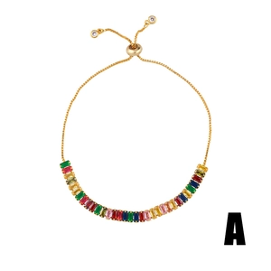 Adjustable gold bracelet for women with rainbow rectangular crystals on white background