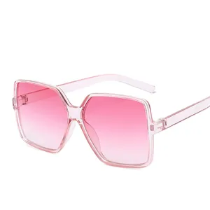 Fashionable oversized square sunglasses with pink gradient lenses and clear pink frames