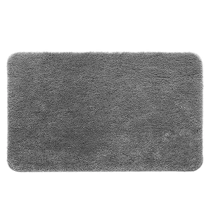 Absorbent grey rectangular bath mat with rounded corners and plush microfiber texture
