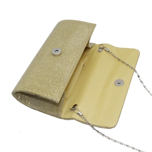 Detail shot of golden glitter evening clutch with magnetic closure and silver chain strap