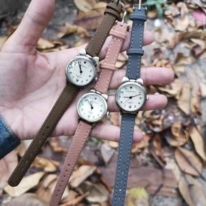 Vintage cat-ear bronze watches with leather straps in brown, pink and grey for women