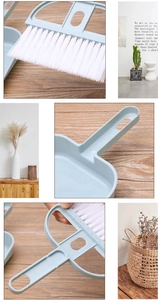 Close-up of mini desktop broom bristles and dustpan handle connection details