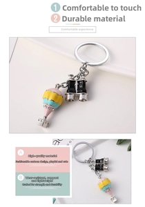 Detail of 3D hot air balloon keychain with rhinestones and binoculars pendant