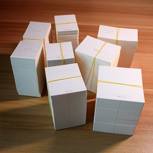 Bulk white cardboard jewelry display cards for earrings and necklaces with nyu branding