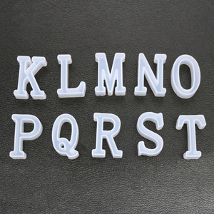 Detail of translucent silicone letter molds K to T for crystal epoxy resin crafts