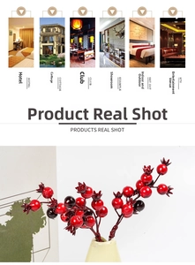Macro detail of artificial red berry branches for Christmas decor in ceramic vase