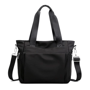 Versatile black nylon tote bag with adjustable shoulder strap and large front pocket
