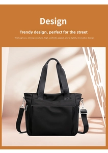 Detail of black nylon tote bag showing metal hardware and adjustable strap