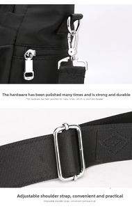 Detail of silver JLS zipper pull and adjustable nylon shoulder strap on black bag