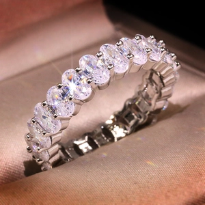 Luxury silver eternity band with sparkling oval-cut cubic zirconia in a jewelry box