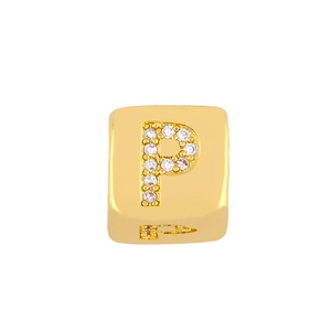 Detailed view of a gold cubic charm with sparkling zircon letter P for DIY necklaces