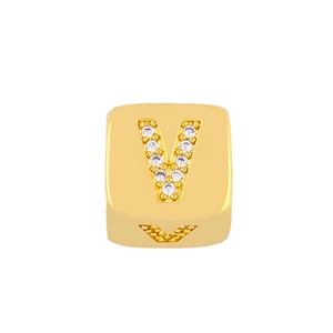 Close-up of golden square pendant with micro-pave letter V detail in sparkling zircons