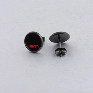 Detail view of 10mm black stainless steel stud earrings showing front and back design