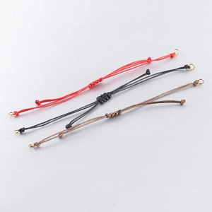 Detail of 0.8mm handmade braided adjustable wax cord strings in red, black, and brown